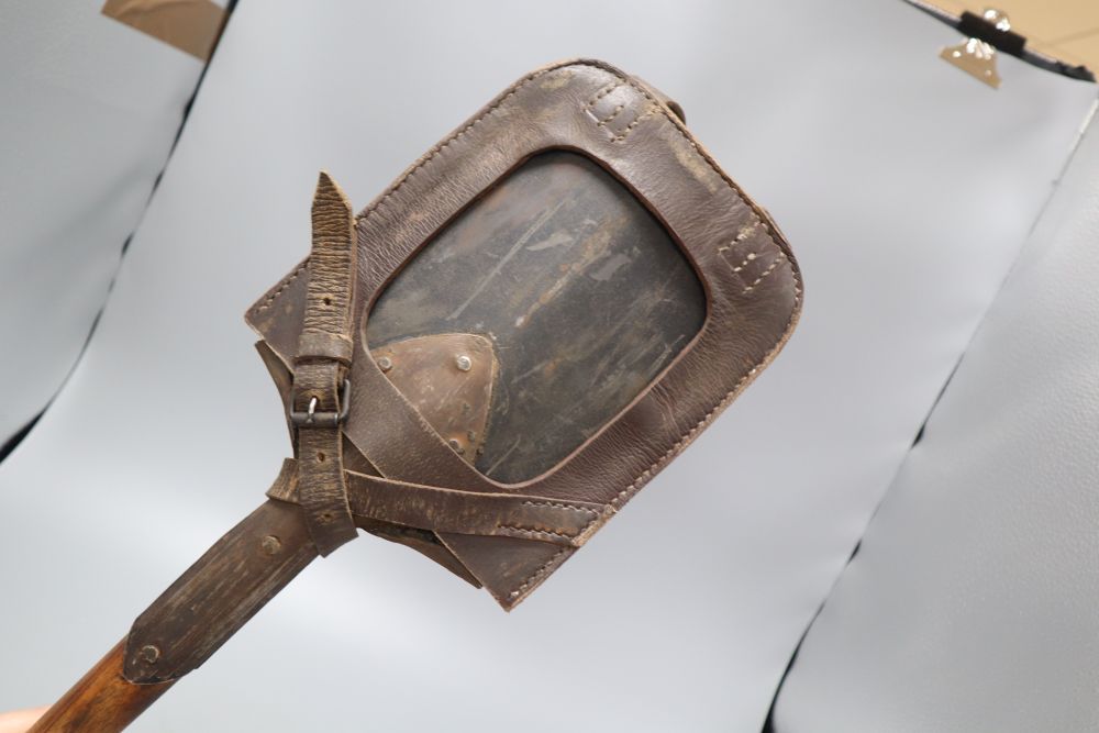 A WWII German Youth shovel, height 51cm, in leather cover and a military mirror